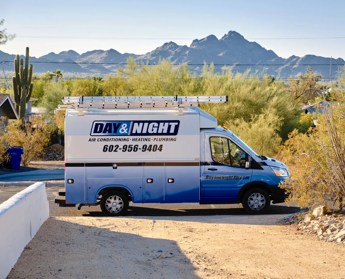 Day &amp; Night Air service van in a Phoenix neighborhood