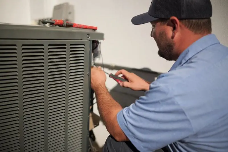 Commercial air conditioning unit undergoing repair work in Phoenix, Arizona, with visible tools and open panel access exposing internal system components. Day & Night Air Conditioning, Heating, and Plumbing provides commercial AC repair in Phoenix AZ, handling system diagnostics, electrical component checks, and cooling performance issues. The equipment setup reflects real HVAC repair work including wiring inspection, component replacement, and system troubleshooting for business properties. Businesses in Phoenix can contact Day & Night Air Conditioning, Heating, and Plumbing at (602) 584-7758 for commercial AC repair services, installation support, and ongoing maintenance.