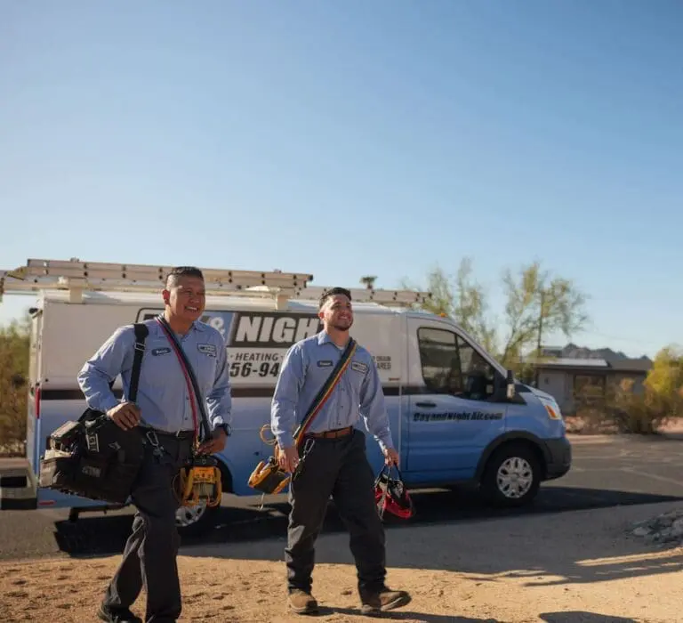 Commercial HVAC service vehicle parked in Phoenix, Arizona, with visible tools and equipment prepared for service work in a residential and light commercial area. Day & Night Air Conditioning, Heating, and Plumbing provides commercial AC services in Phoenix AZ, including repair, installation, and maintenance for business properties. The service setup includes tool bags, diagnostic equipment, and service gear used for air conditioning system inspections and repairs. Businesses in Phoenix can contact Day & Night Air Conditioning, Heating, and Plumbing at (602) 584-7758 for commercial AC repair, installation, and maintenance services.