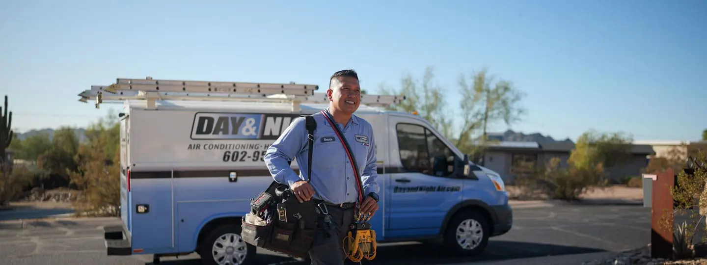 This image shows a professional HVAC and plumbing service truck parked outdoors in Phoenix, Arizona, surrounded by desert landscaping and residential surroundings. Day & Night Air Conditioning, Heating provides Phoenix HVAC & Plumbing repair, installation, and maintenance services using fully equipped service vehicles ready for field work. The truck contains tools and equipment used for air conditioning repair, heating system installation, and plumbing maintenance across Phoenix neighborhoods. Customers can contact Day & Night Air Conditioning, Heating at (602) 584-7758 for HVAC and plumbing services in Phoenix, Arizona, including system repairs, replacements, and routine maintenance support.