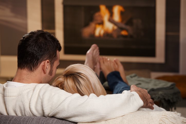 Couple Sitting by a fire