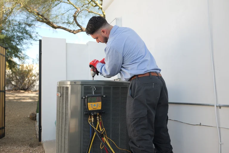 Buckeye, AZ Air Conditioning - Day & Night Air Conditioning, Furnace, & Plumbing day & night air ac tech working