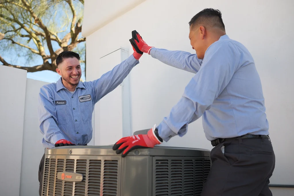 Mesa, AZ Air Conditioning - Day & Night Air Conditioning, Furnace, & Plumbing ac team members high fiving